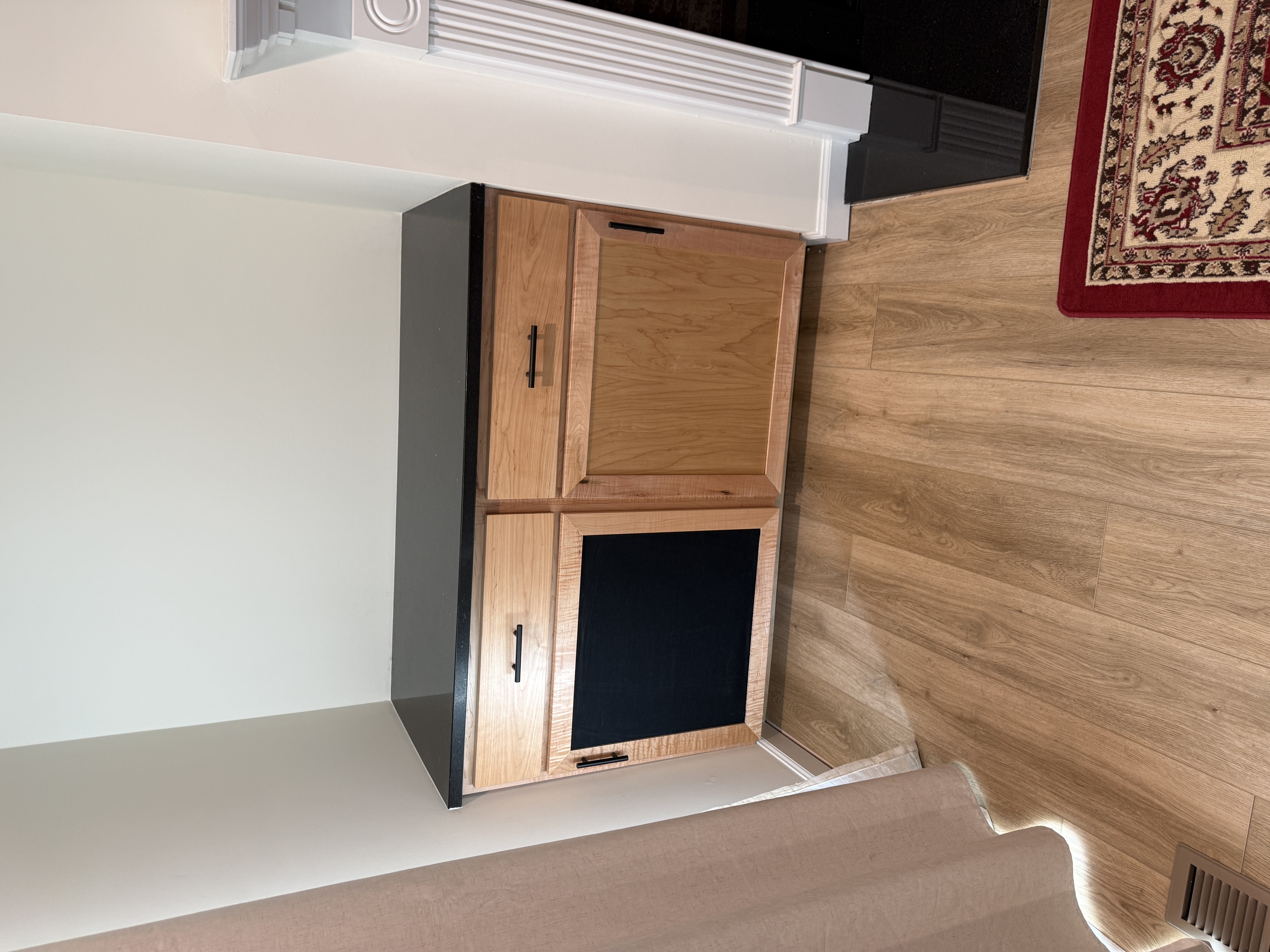 Custom cabinet with contrasting black inset panel